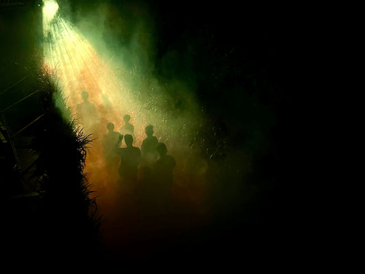 people in eerie glow of ufo