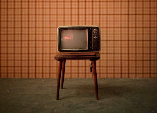 Small vintage tv on a stool