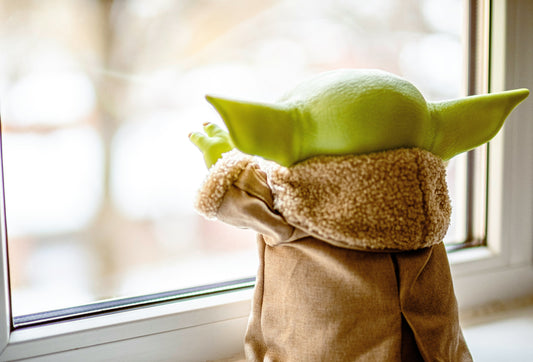 alien looking out the window 